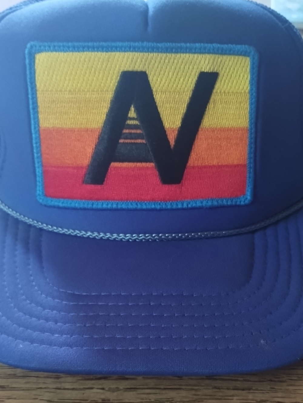 Aviator Nation Blue Trucker Hat with Yellow-Orange-Red AV Patch